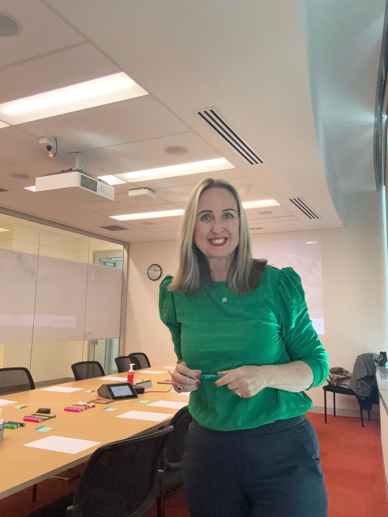 Gabby working with a leadership team around a table
