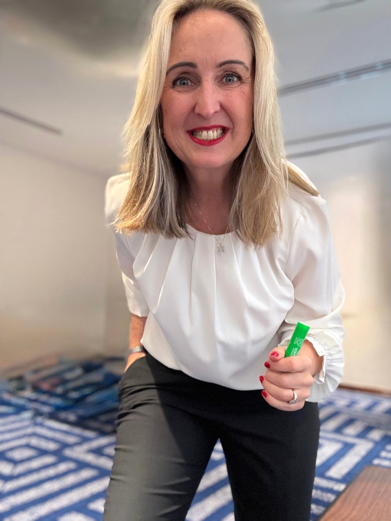 Gabby Horak grinning with a marker in hand